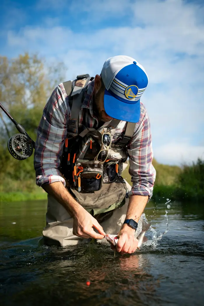 A guide preparing flies for the day